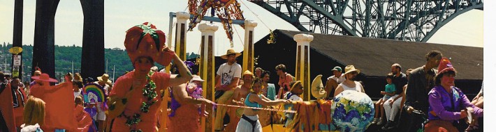 "Solstice Parade 1992 Aurora Bridge" by Joe Mabel - Photo by Joe Mabel. Licensed under CC BY-SA 3.0 via Commons - https://commons.wikimedia.org/wiki/File:Solstice_Parade_1992_Aurora_Bridge.jpg#/media/File:Solstice_Parade_1992_Aurora_Bridge.jpg